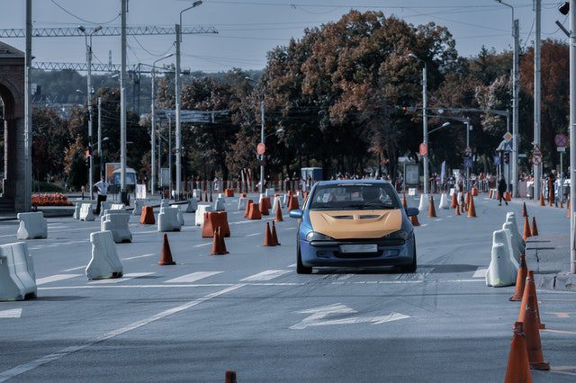 Anonymous person riding car